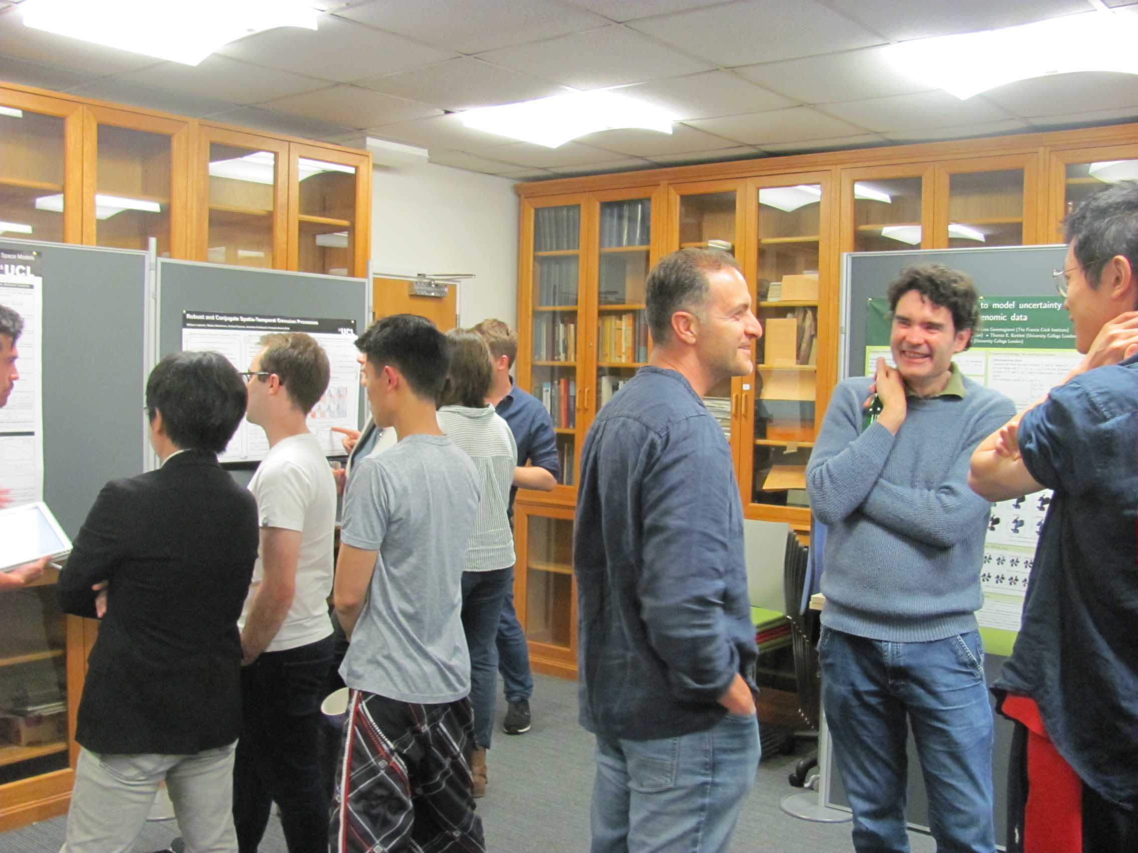 Photograph of attendees at the poster session following the symposium.